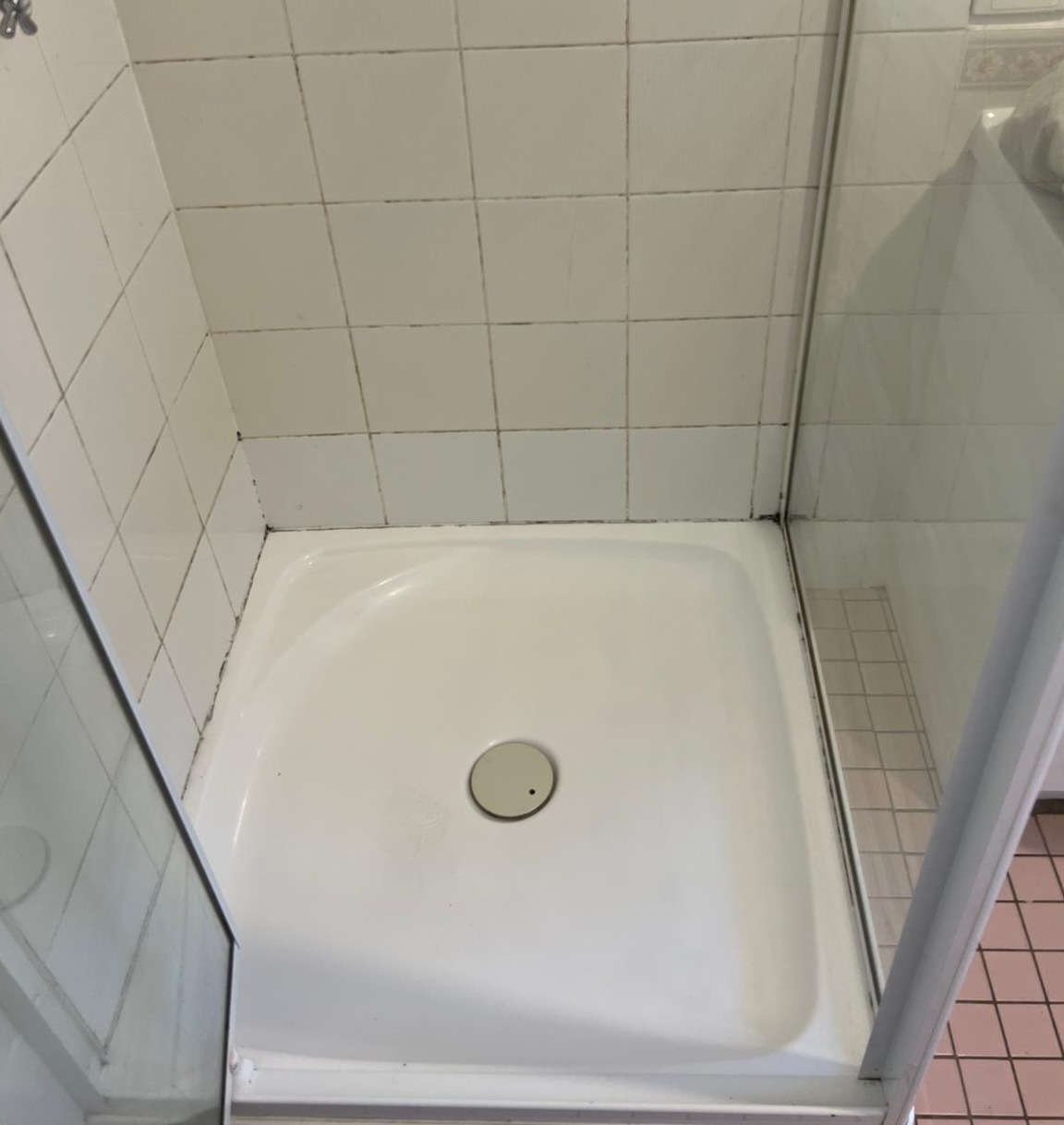 Gold Coast shower regrouting - after: fresh white epoxy grout with professional waterproof sealing